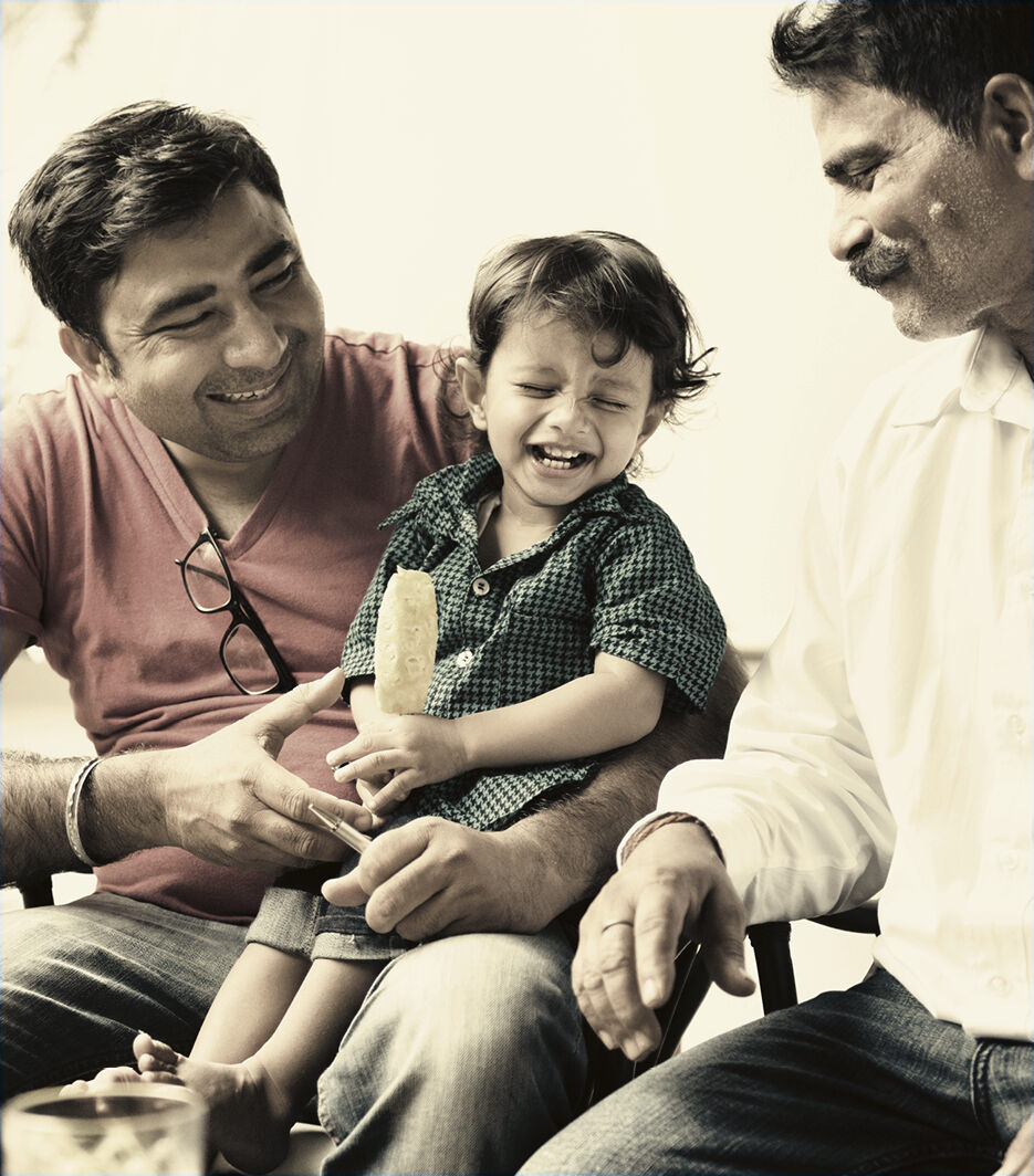 A father, kid, and grandfather share a laugh in their new home in Ajax.
